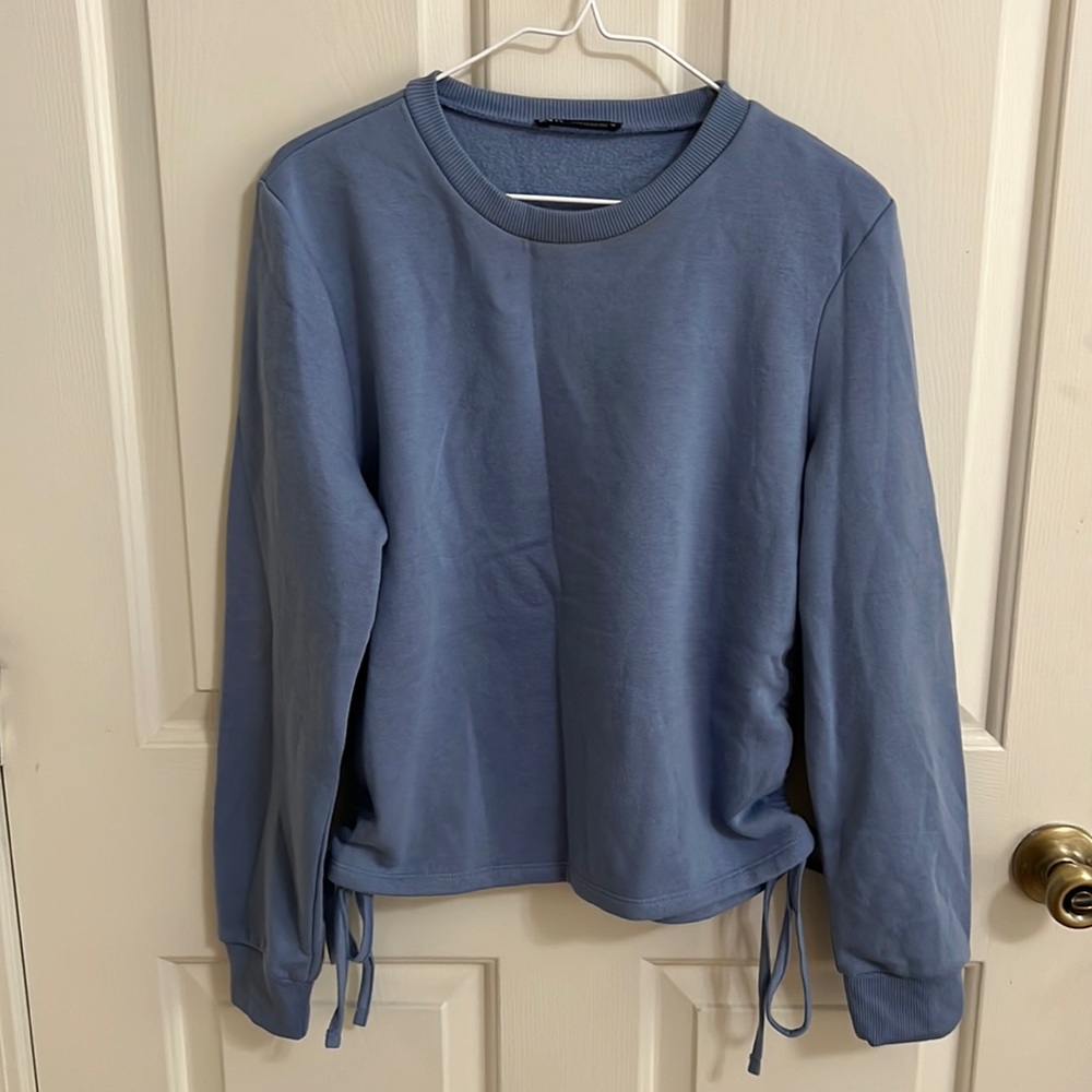 Zara Size S, periwinkle sweatshirt with ties on the side. Like new